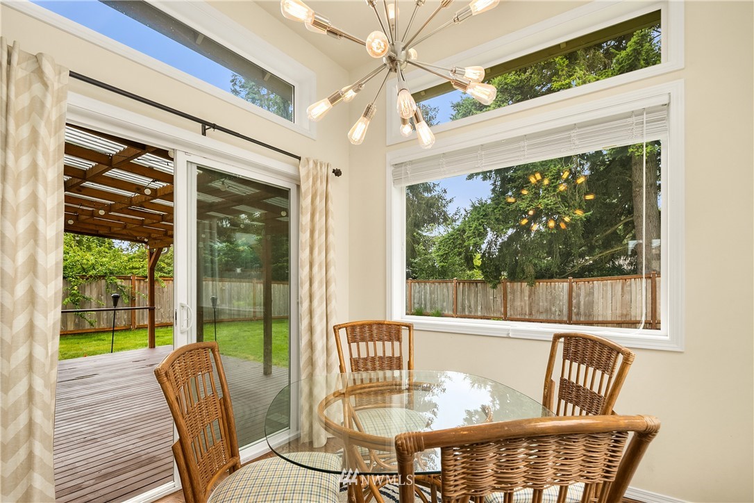 909 Graham Avenue Northeast Renton, WA 98059 - Photo 12 of 32 a view of a dining room with furniture window and outside view