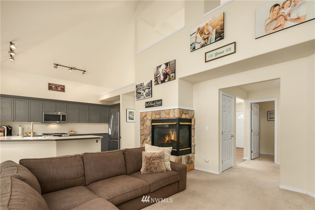 909 Graham Avenue Northeast Renton, WA 98059 - Photo 18 of 32 a living room with furniture and a fireplace