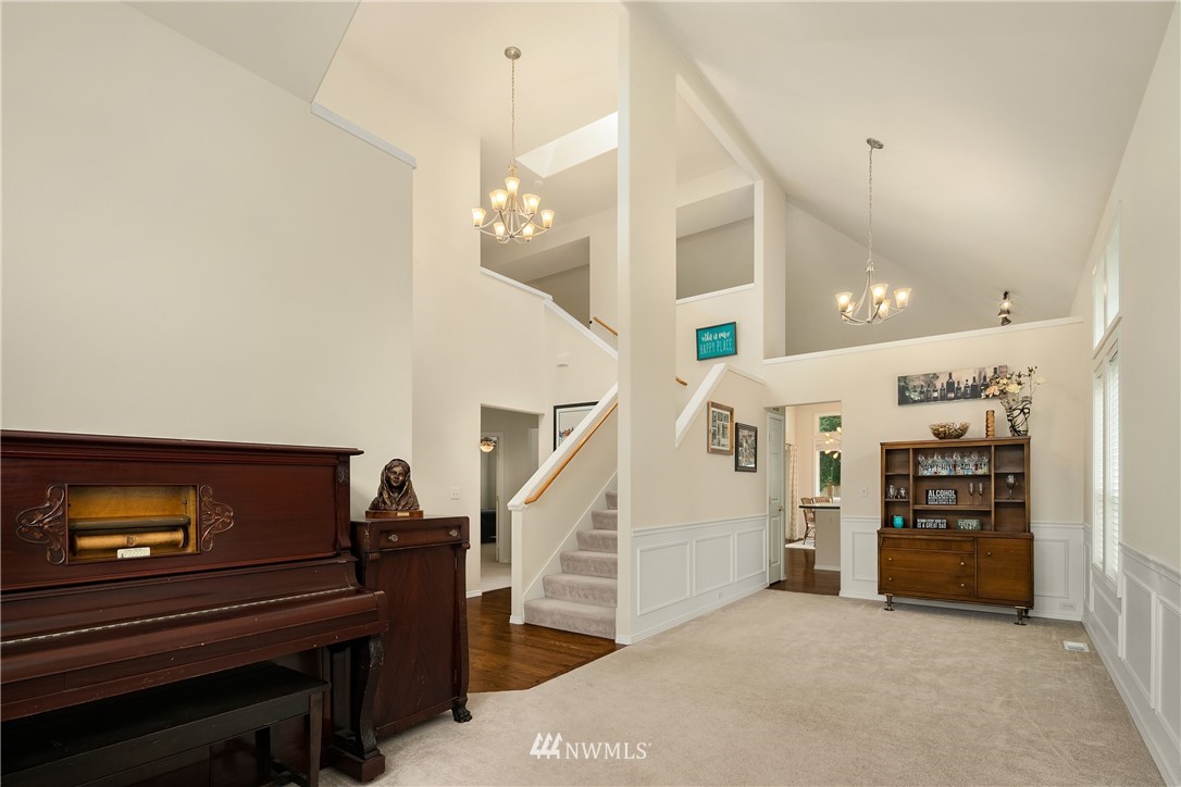 909 Graham Avenue Northeast Renton, WA 98059 - Photo 3 of 32 a view of a livingroom with furniture and stairs