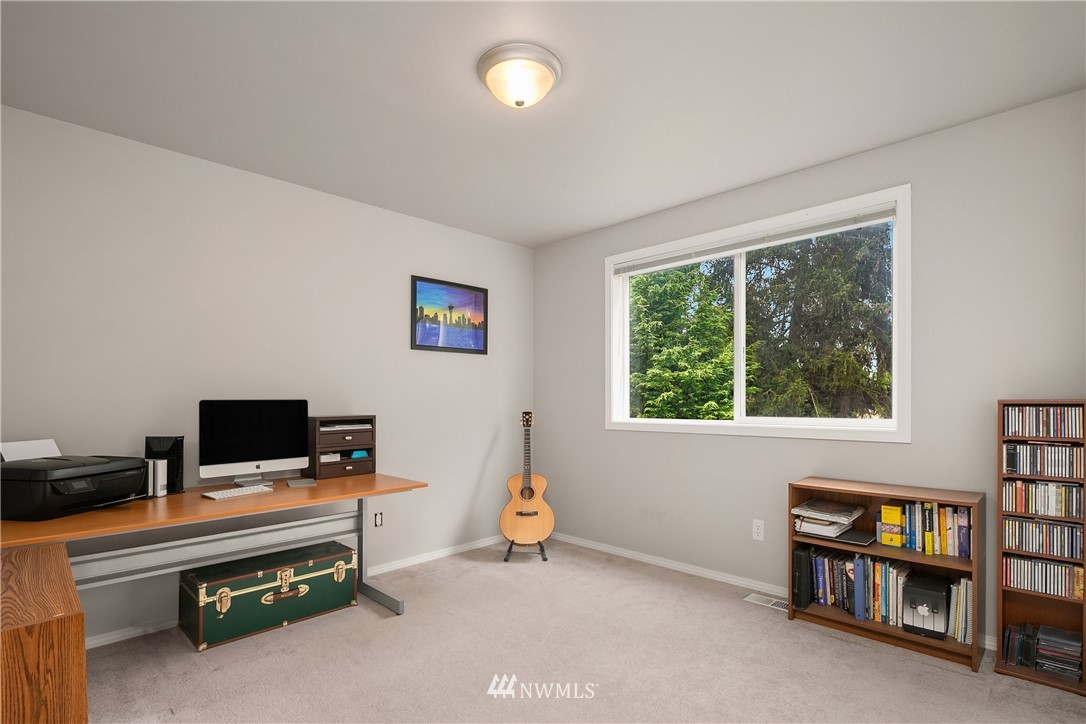 909 Graham Avenue Northeast Renton, WA 98059 - Photo 26 of 32 a room with furniture and a window
