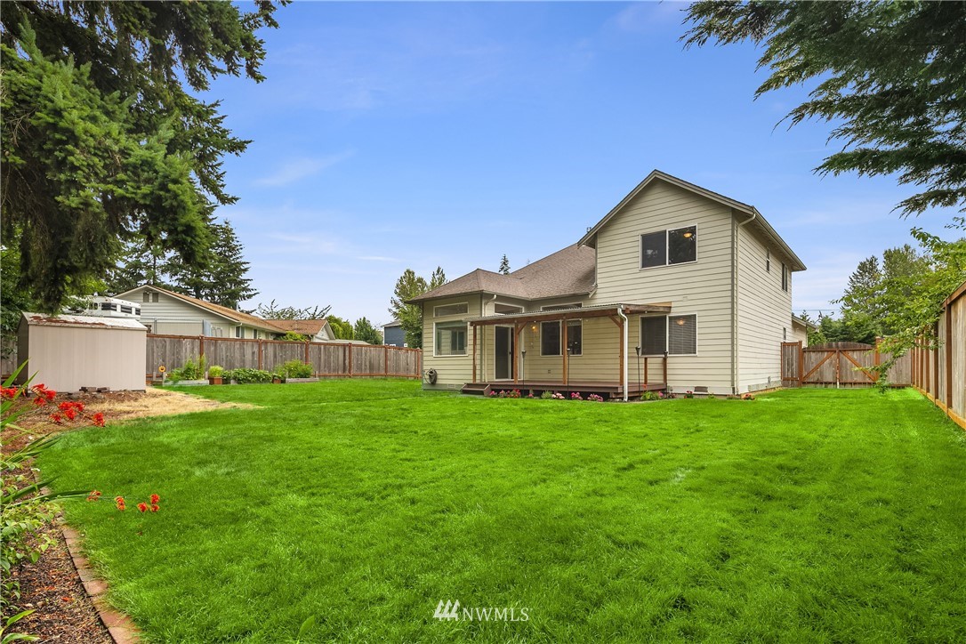 909 Graham Avenue Northeast Renton, WA 98059 - Photo 30 of 32 a view of a house with a yard
