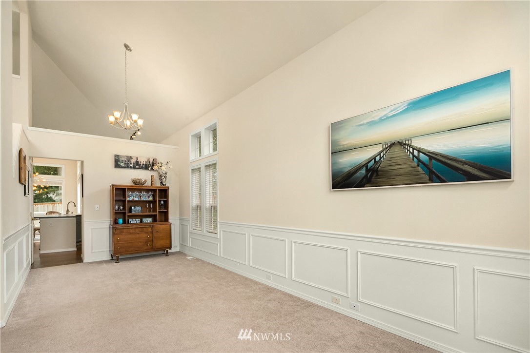 909 Graham Avenue Northeast Renton, WA 98059 - Photo 4 of 32 a view of a hallway with wooden shelves