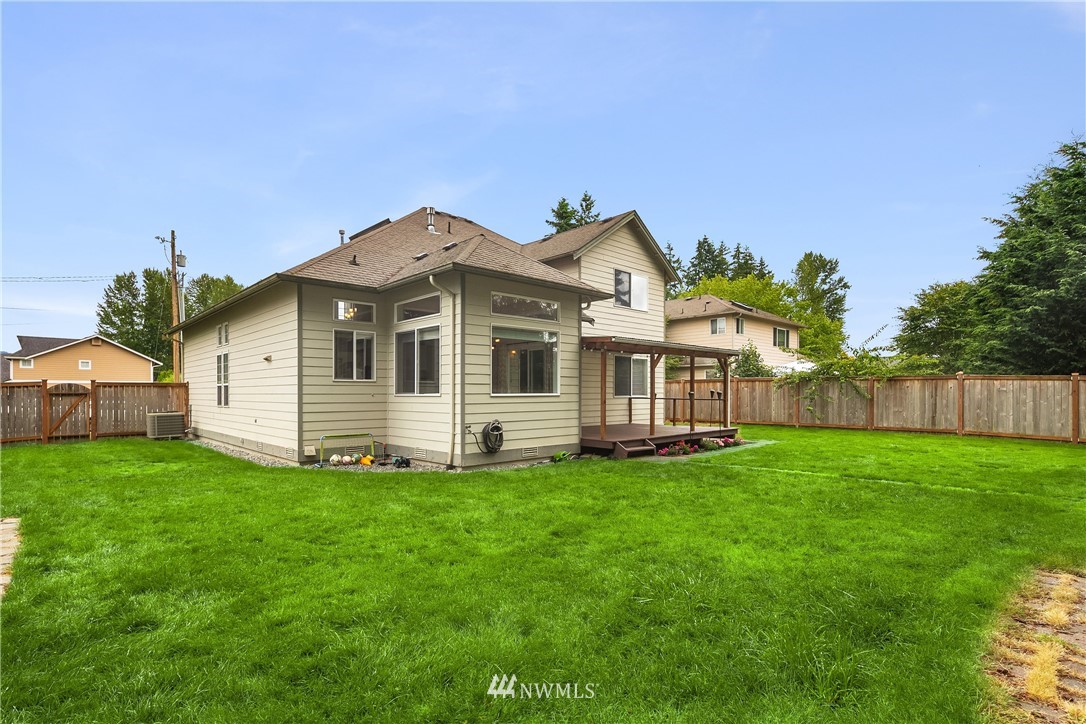 909 Graham Avenue Northeast Renton, WA 98059 - Photo 31 of 32 a view of a house with a yard