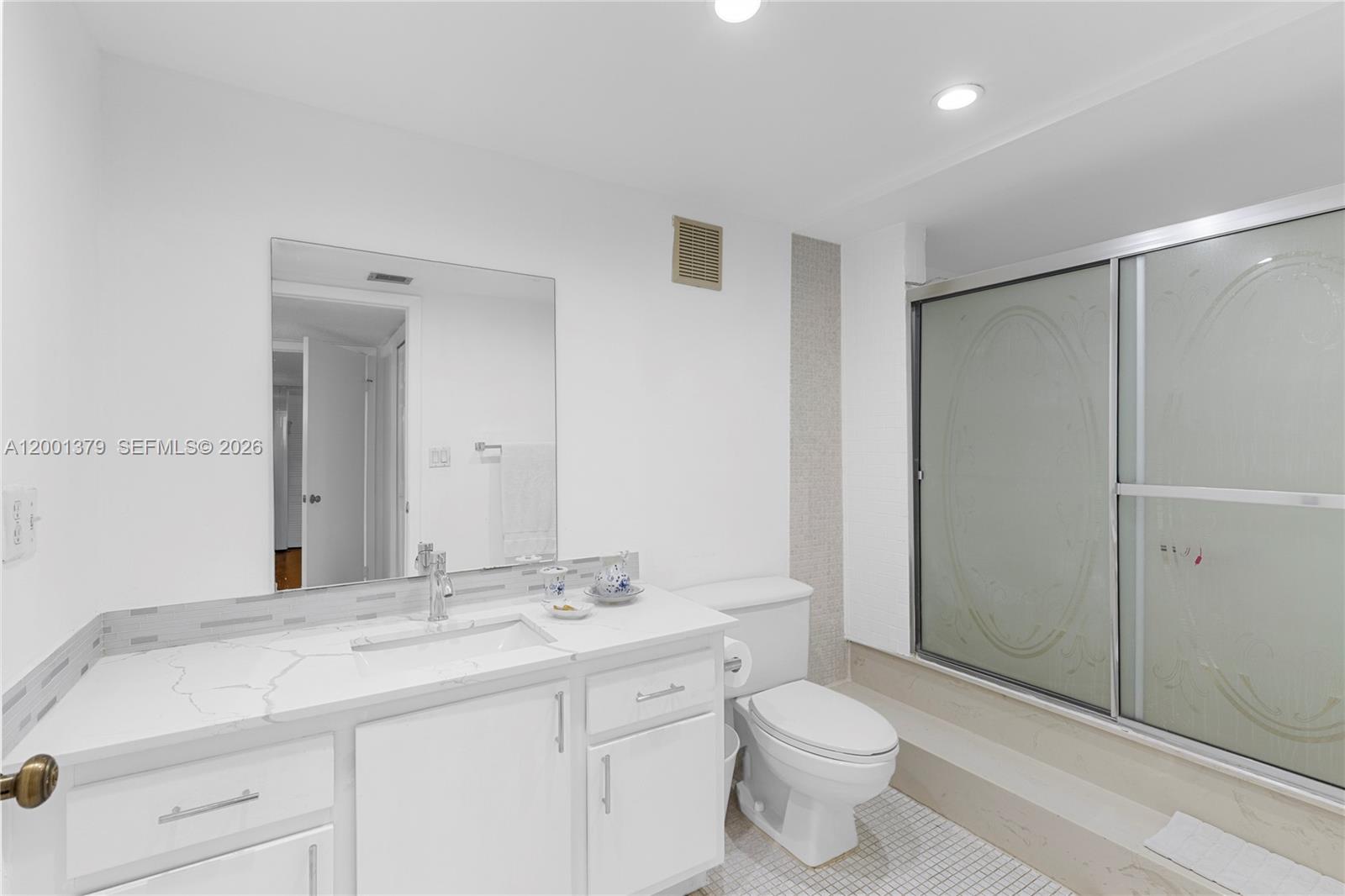 16251 Golf Club Road, Unit 311 Weston, FL 33326 - Photo 20 of 38 a bathroom with a sink toilet and shower