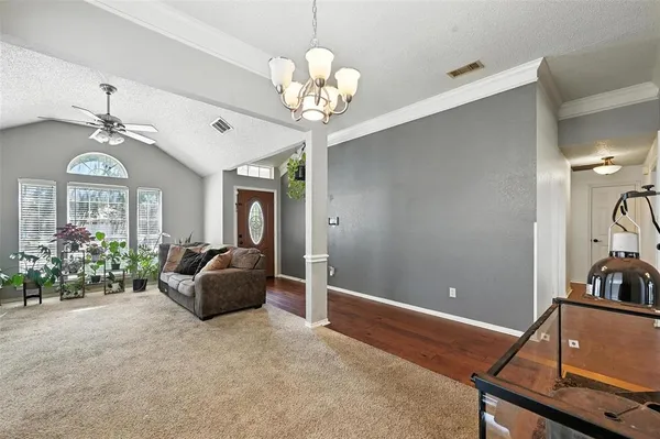 a view of a livingroom with furniture and a chandelier