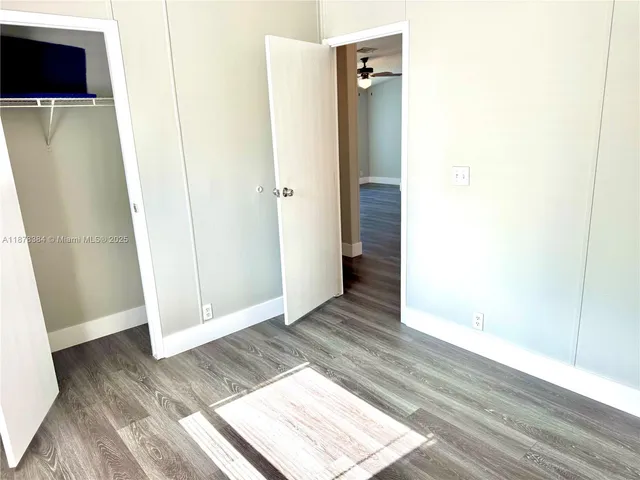 a view of entryway with wooden floor