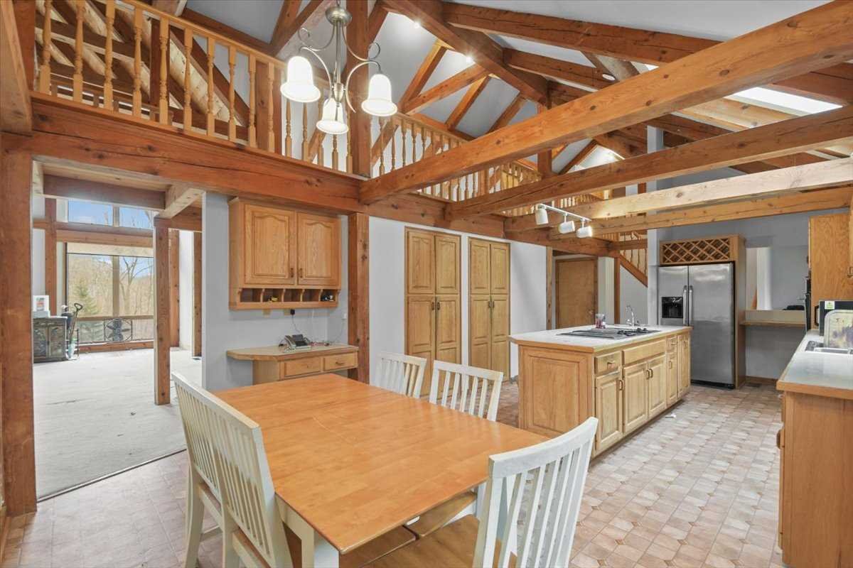 121 Cornwall Hill Road Patterson, NY 12563 - Photo 12 of 37 a large white kitchen with a large window and furniture
