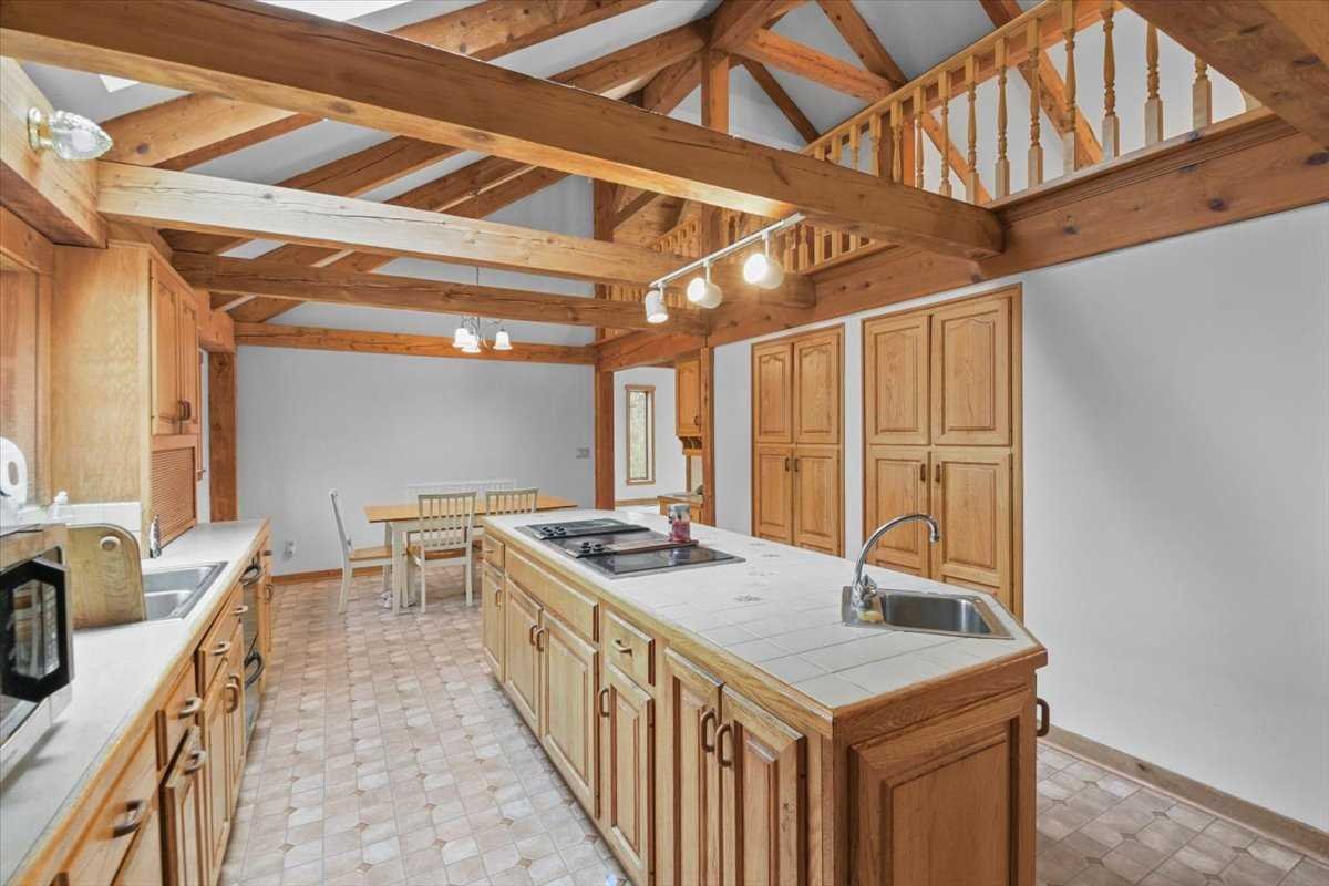 121 Cornwall Hill Road Patterson, NY 12563 - Photo 16 of 37 a kitchen with a stove a sink and a refrigerator