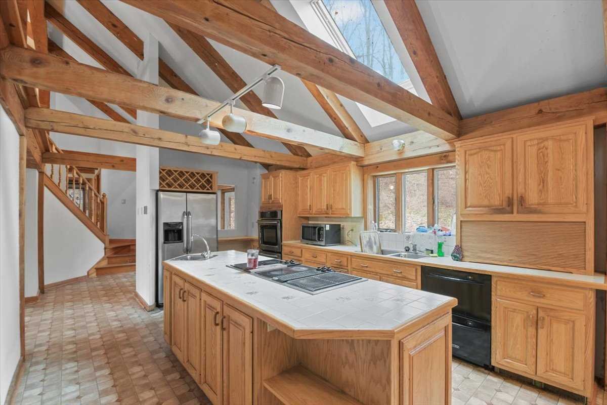 121 Cornwall Hill Road Patterson, NY 12563 - Photo 17 of 37 a kitchen with a stove a sink and a refrigerator