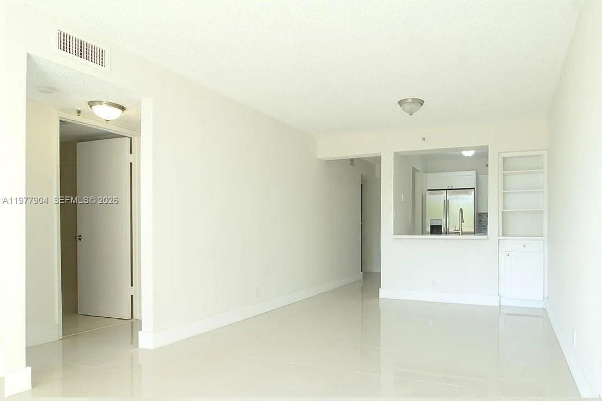 546 Southwest 1st Street, Unit 404 Miami, FL 33130 - Photo 3 of 9 a view of a bathroom from the hallway