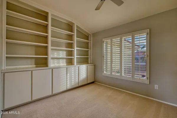 a room with closet and windows