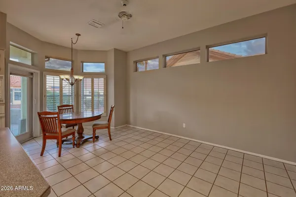 a view of a dining room with furniture window and outside view