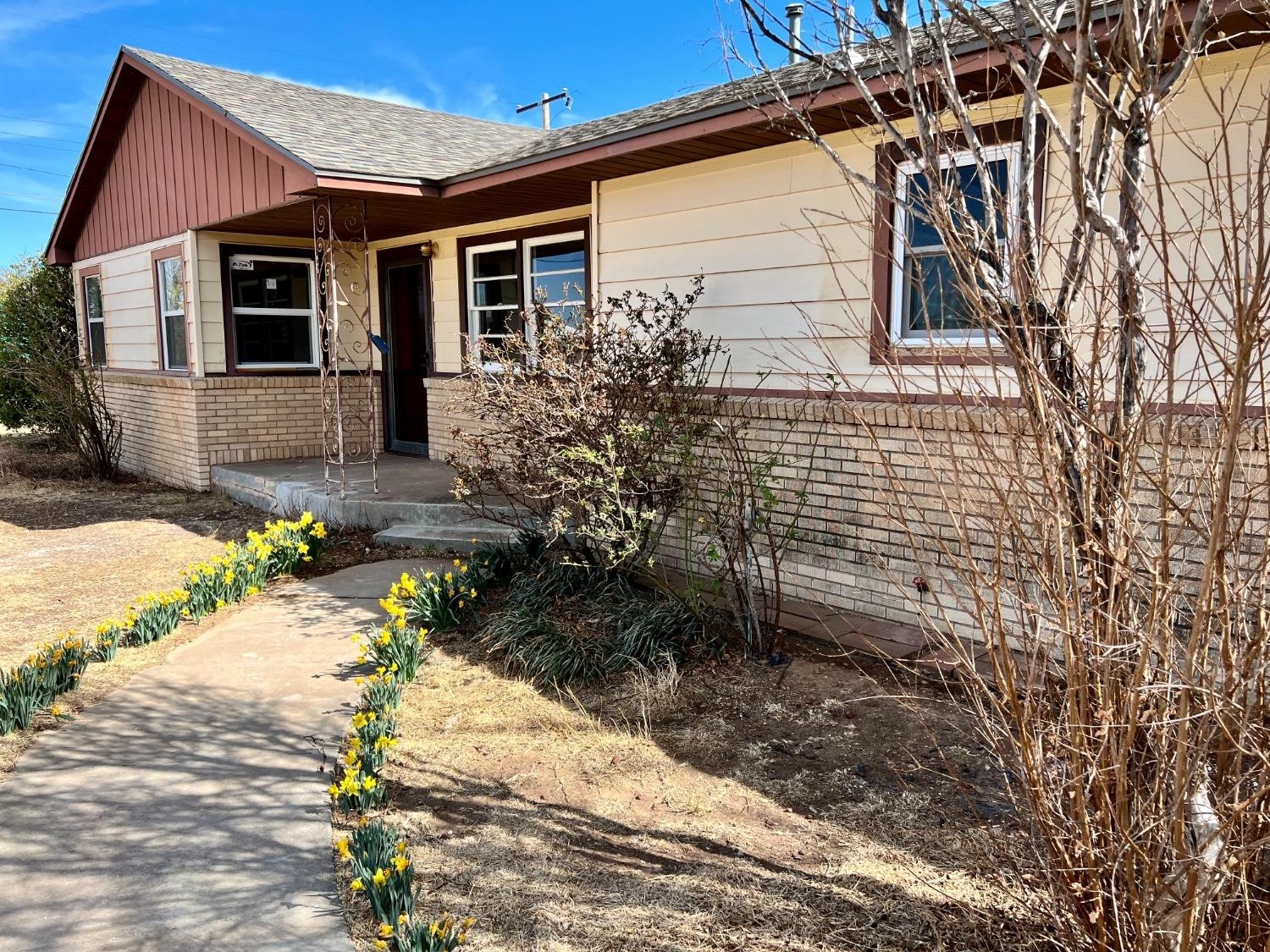 212 12th Street Ralls, TX 79357 - Photo 23 of 24 a front view of a house with a yard