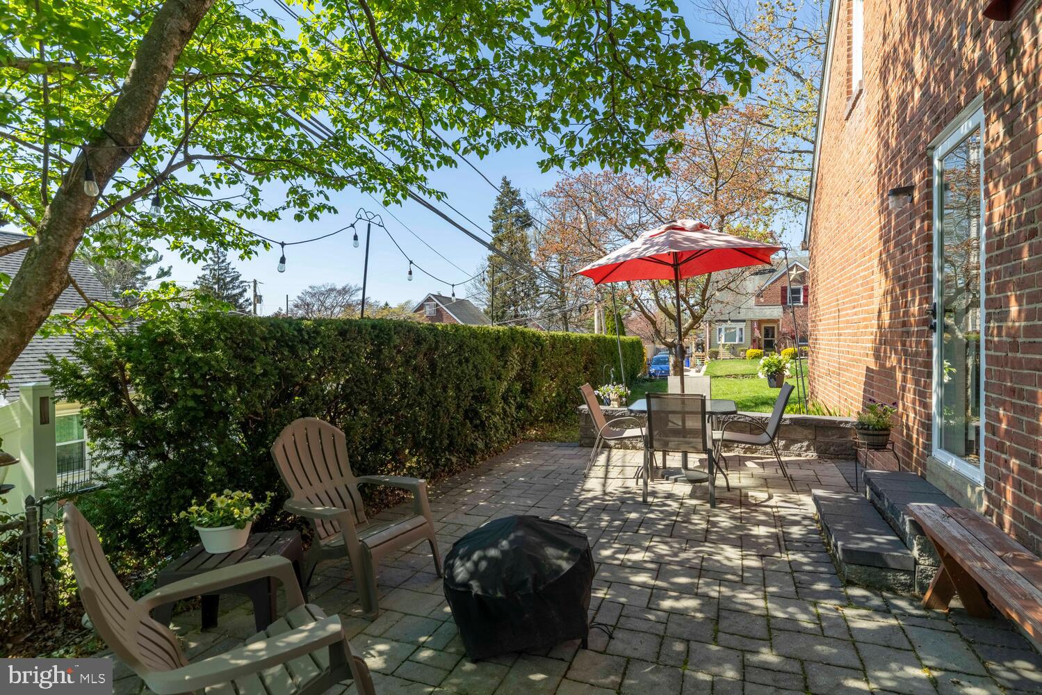 315 Edgemore Road Secane, PA 19018 - Photo 28 of 35 Sunny patio retreat with vibrant greenery.