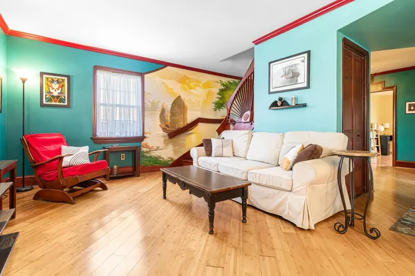 a living room with furniture and a window