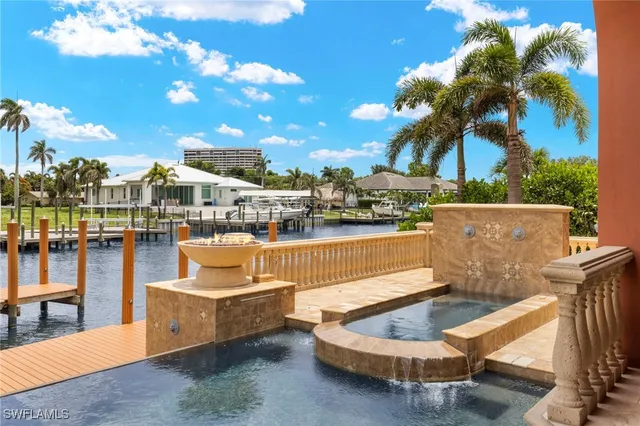 a view of a swimming pool with a lounge chairs
