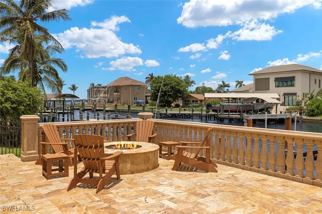 a roof deck with table and chairs