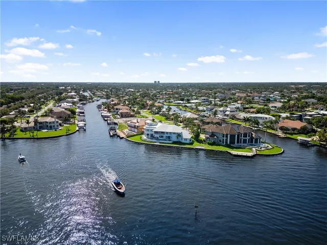 an aerial view of a house with a lake view
