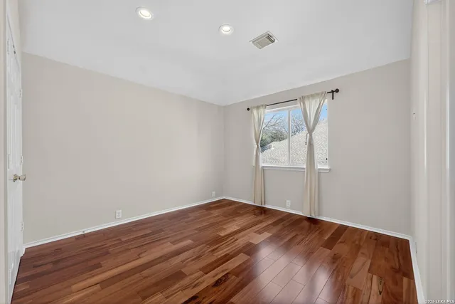 a bathroom with a double vanity sink a mirror and a shower