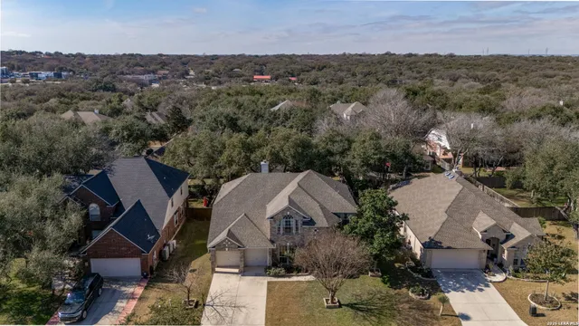 an aerial view of a house with a yard