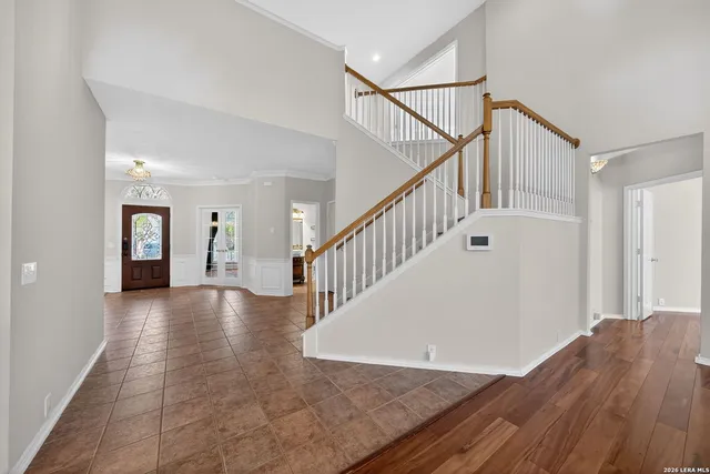 a view of an entryway with wooden floor