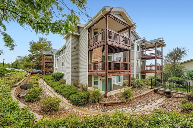 a view of a brick building next to a yard