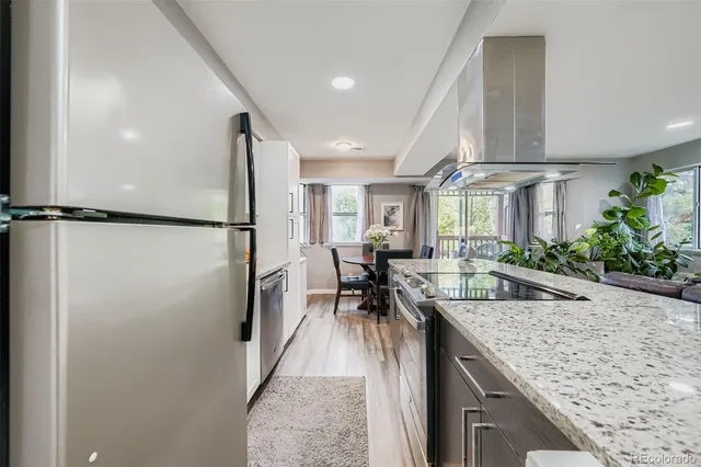 a kitchen with counter top space and stainless steel appliances