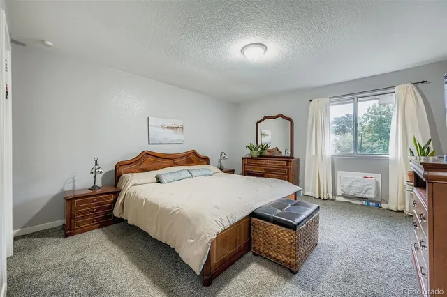 a bedroom with a bed and a view of bedroom