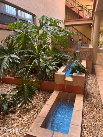 a view of swimming pool with seating space