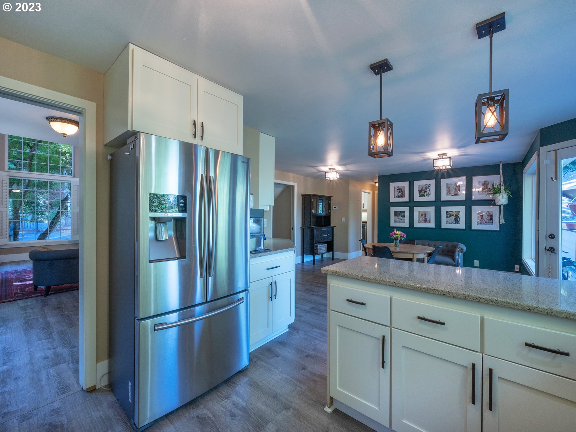 3875 Ashford Drive Eugene, OR 97405 - Photo 14 of 44 a kitchen with refrigerator a sink and cabinets