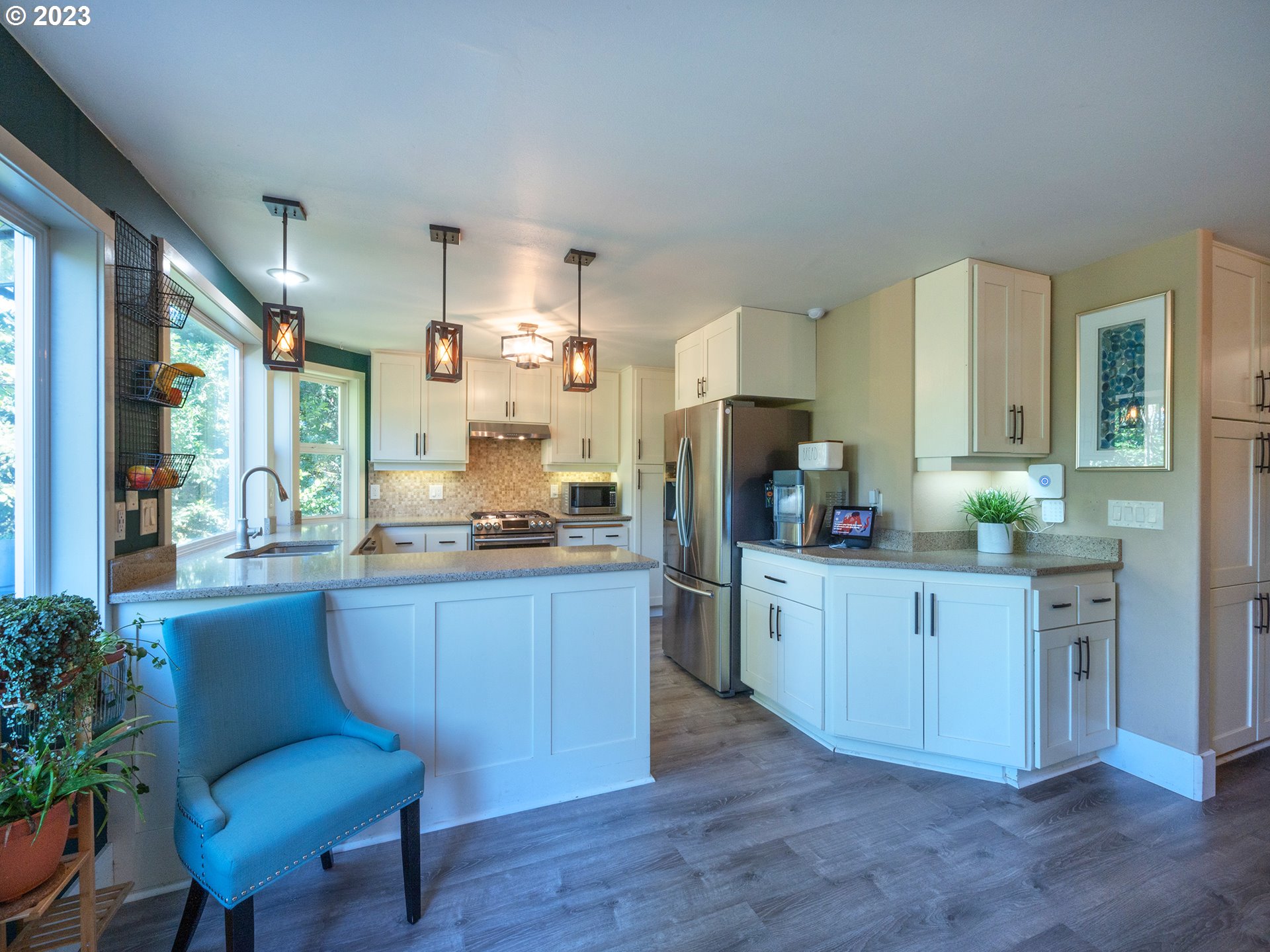 3875 Ashford Drive Eugene, OR 97405 - Photo 16 of 44 a kitchen with sink cabinets and chair