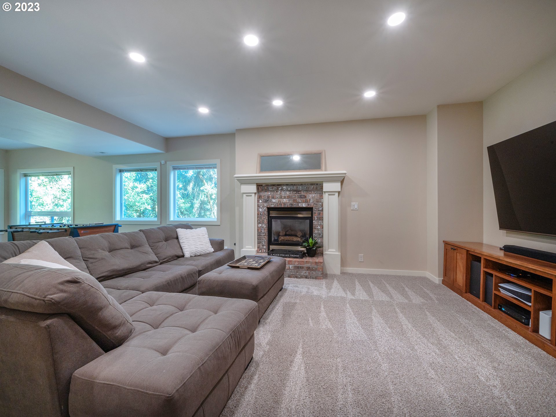 3875 Ashford Drive Eugene, OR 97405 - Photo 29 of 44 a living room with furniture and a flat screen tv