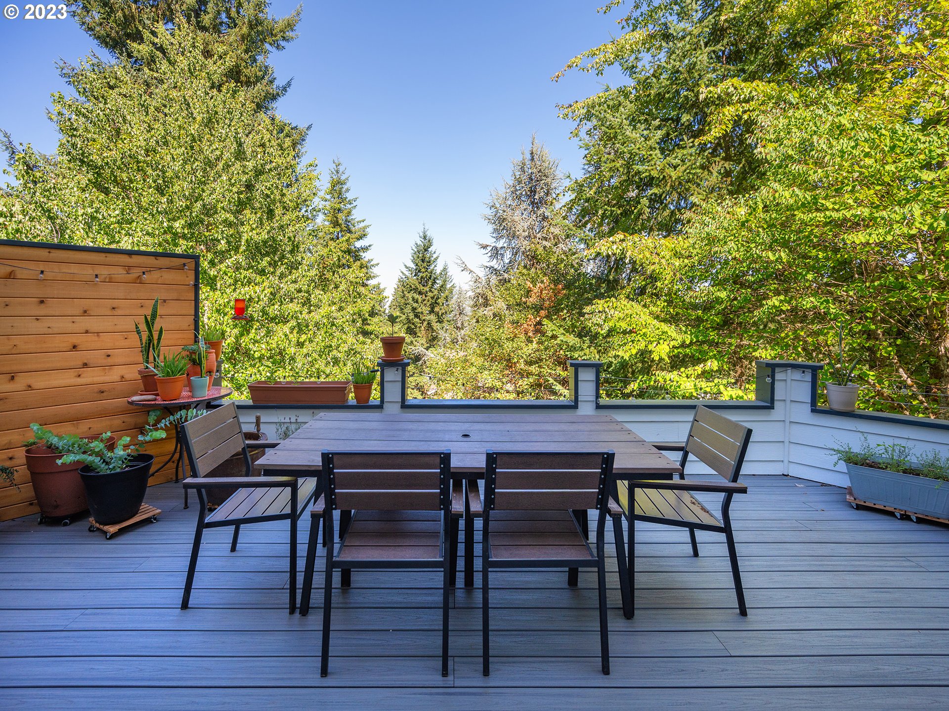 3875 Ashford Drive Eugene, OR 97405 - Photo 33 of 44 a patio with wooden floor and outdoor seating