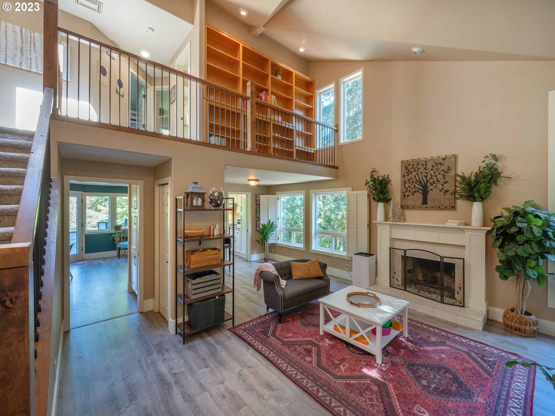 3875 Ashford Drive Eugene, OR 97405 - Photo 7 of 44 a living room with furniture fireplace and a window