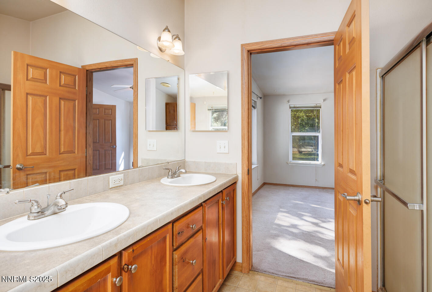1480 River View Drive Fallon, NV 89406 - Photo 16 of 32 a bathroom with a granite countertop sink and a mirror