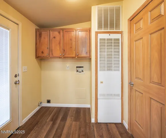 a view of front door with wooden floor