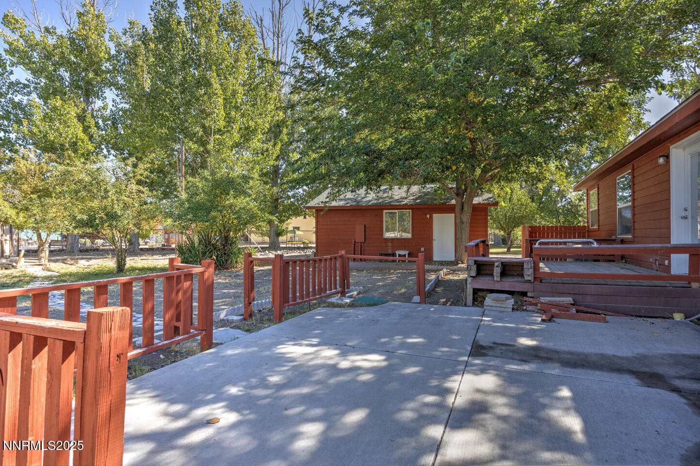 1480 River View Drive Fallon, NV 89406 - Photo 24 of 32 a view of backyard with outdoor seating and trees
