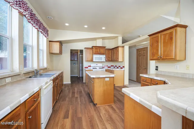 a kitchen with a sink stove and refrigerator