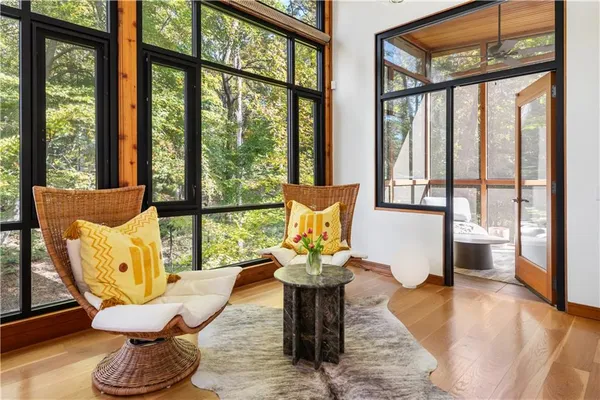 a kitchen with a table chairs refrigerator and cabinets
