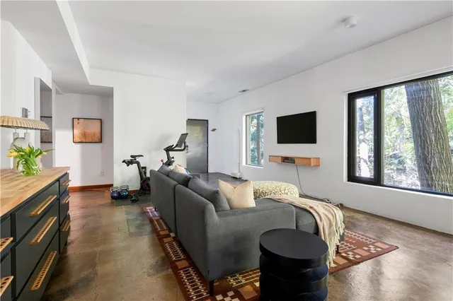 a view of a dining room with furniture and window