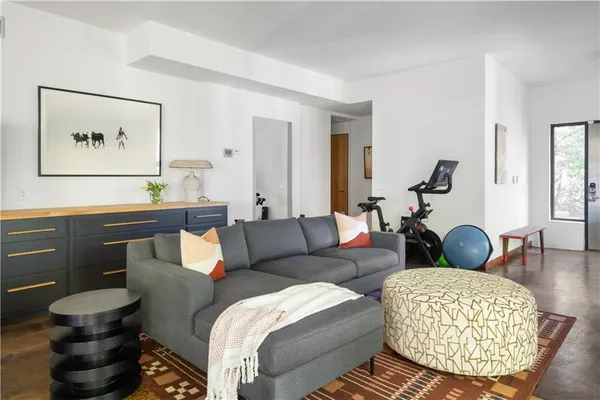 a view of a dining room with furniture and a large window