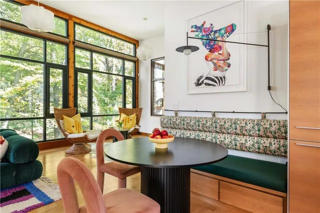 a view of a dining room with furniture and wooden floor