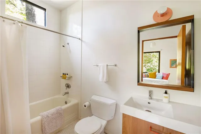 a work room with furniture and a wooden floor