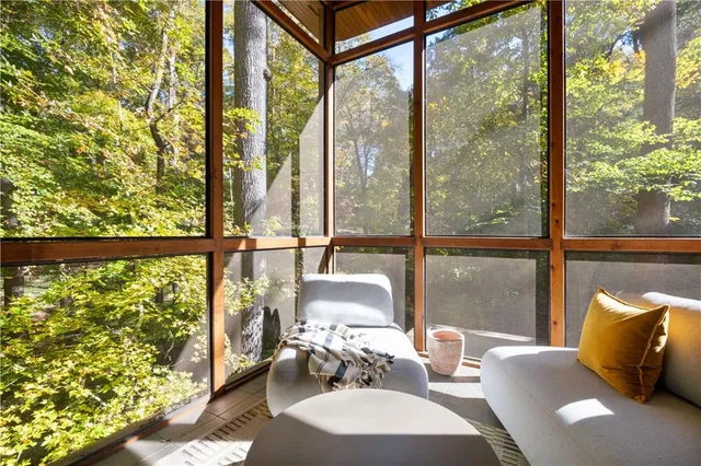 a bedroom with furniture and a window