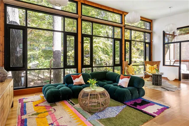 a living room with furniture tv and a flat screen tv