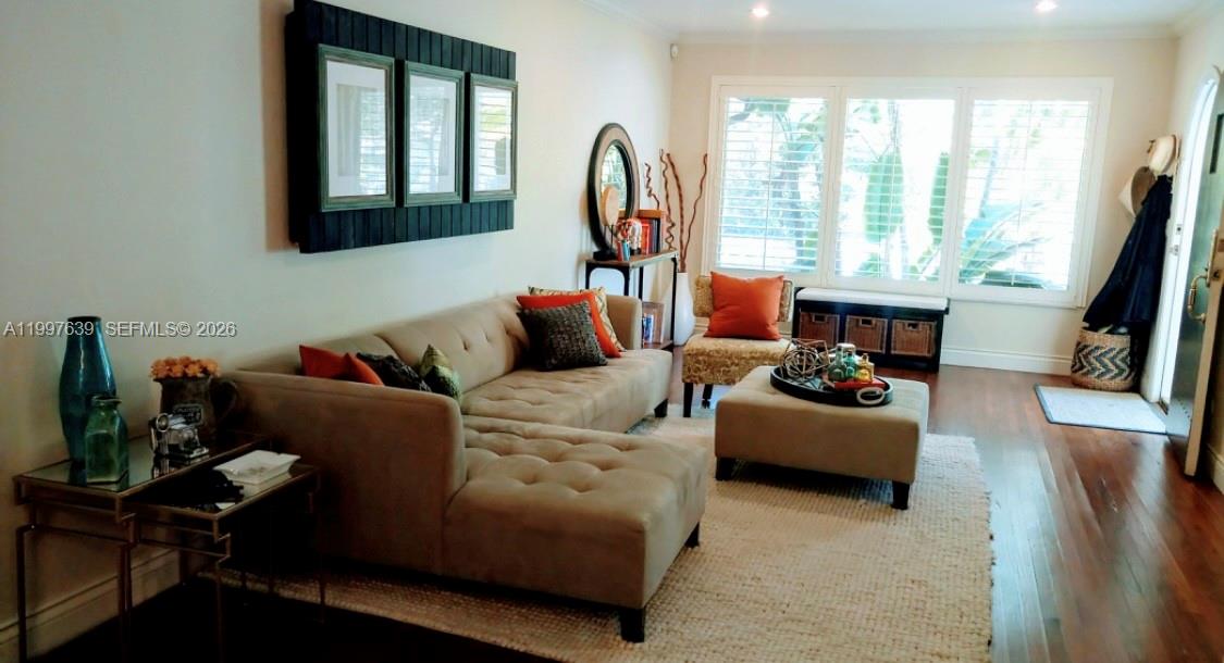 5718 Southwest 48th Street South Miami, FL 33155 - Photo 4 of 9 a living room with furniture fireplace and a large window