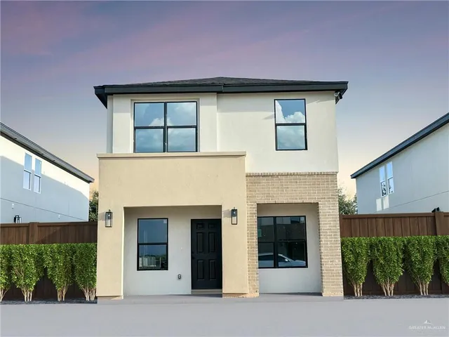 a front view of a house with garage