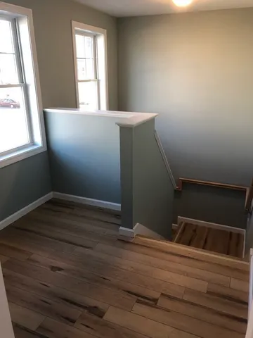 a bathroom with a sink toilet and a window