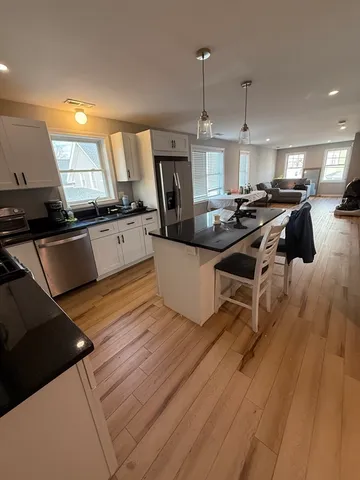 a bathroom with a sink a mirror and a toilet