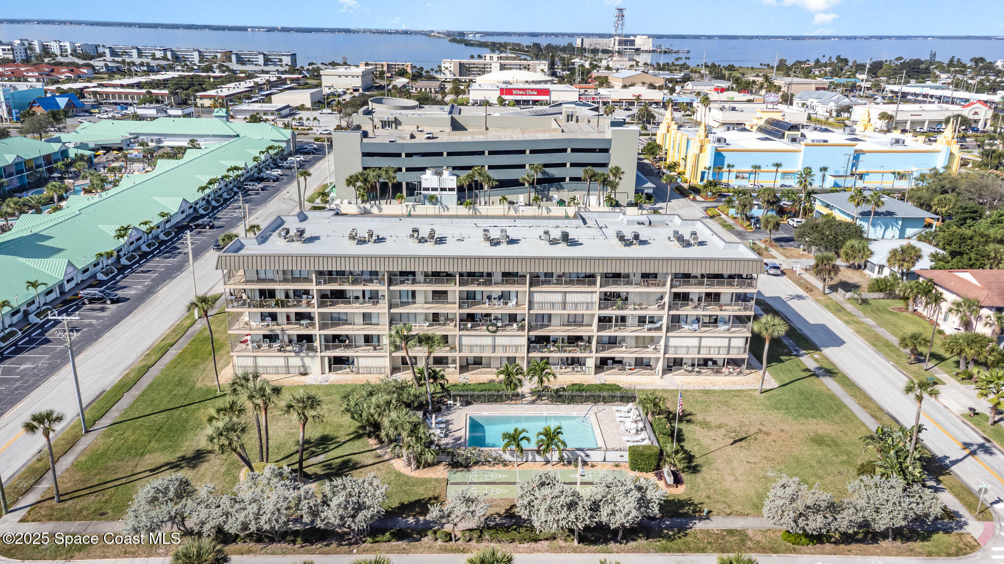 4105 Ocean Beach Boulevard, Unit 422 Cocoa Beach, FL 32931 - Photo 1 of 15 a large building with a outdoor space